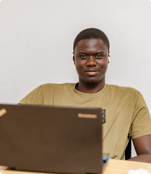 Portrait of a student holding a laptop
