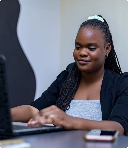 Portrait of a student typing on a laptop