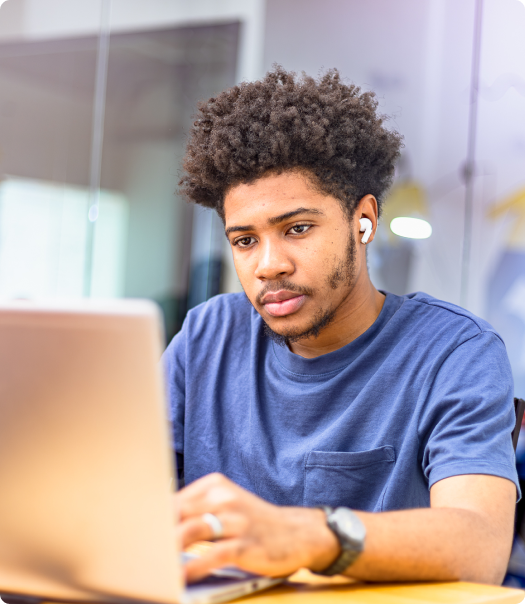 Portrait of a young learner at a laptop